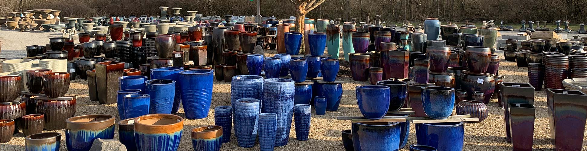 Selection of blue pottery planters at Aquatic & Garden Decor in Cincinnati
