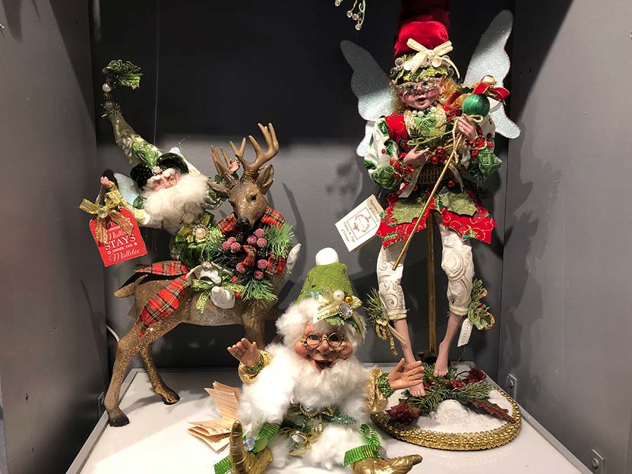 Collection of Mark Roberts fairies and other Christmas figures sitting on a shelf