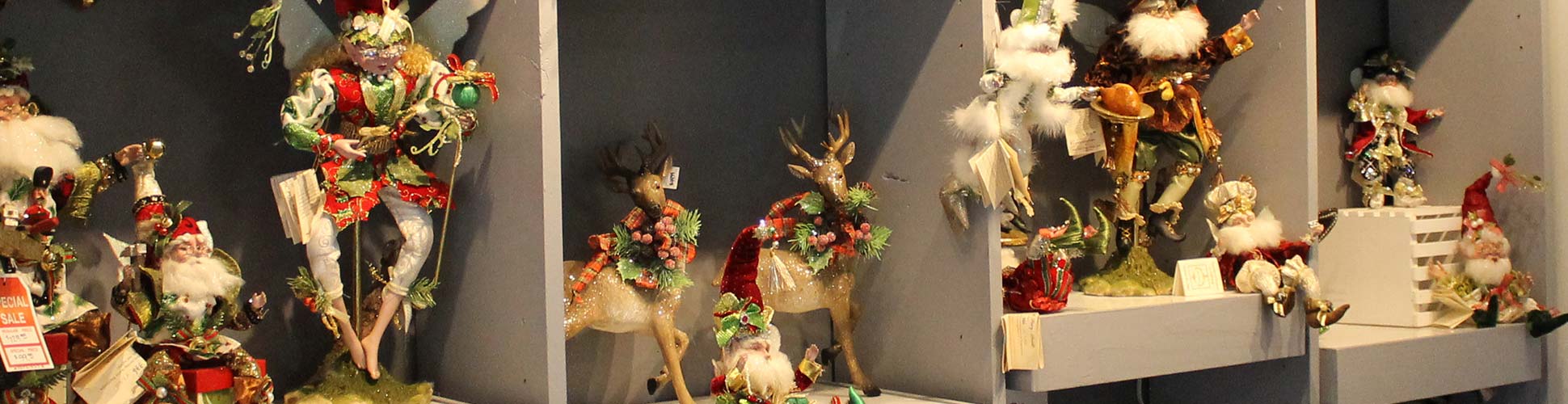 Large collection of Mark Roberts fairies for sale on display shelves in Cincinnati, OH