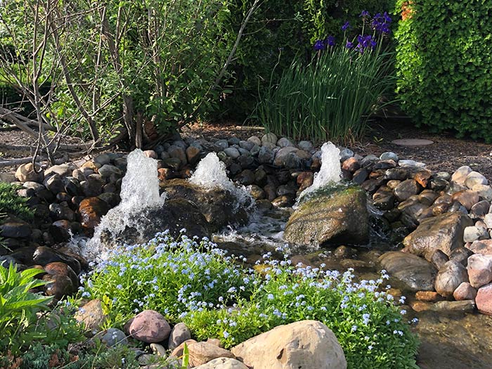 Rock garden pond with fountains, using several different water garden supplies