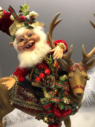 Mark Roberts Santa doll riding a reindeer