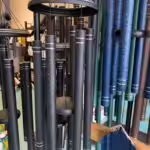 Closeup of large black, blue and green Corinthian Bells wind chimes for sale in Cincinnati, OH