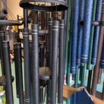 Closeup of large black, blue and green Corinthian Bells wind chimes for sale in Cincinnati, OH